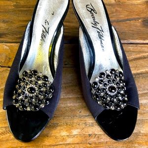 Beverly Feldman slingback wedge with glass and metal flower. Lacquered base.